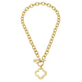 Gold chain necklace with a clover-shaped pendant on a white background
