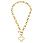 Gold chain necklace with a clover-shaped pendant on a white background