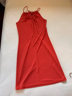 Coral dress on a white surface