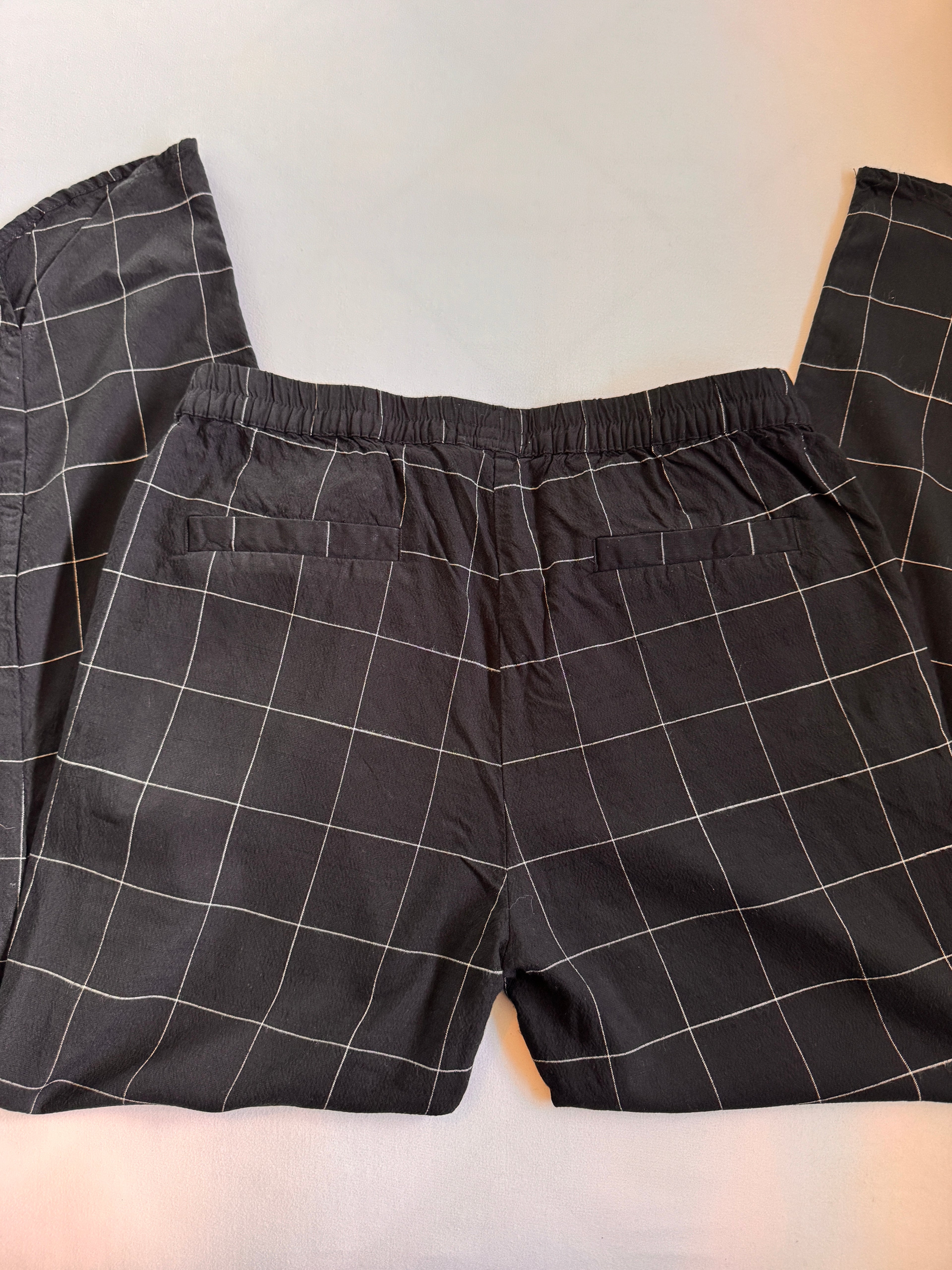 Black checkered pants on a light background