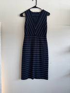 Navy pinstripe dress on a white background