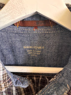 Close-up of a denim garment with 'Banana Republic' branding on a mannequin.