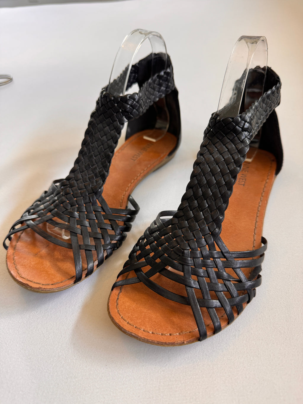 black leather women sandals on a white background