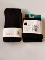 Two pairs of black socks with labels on a light gray background