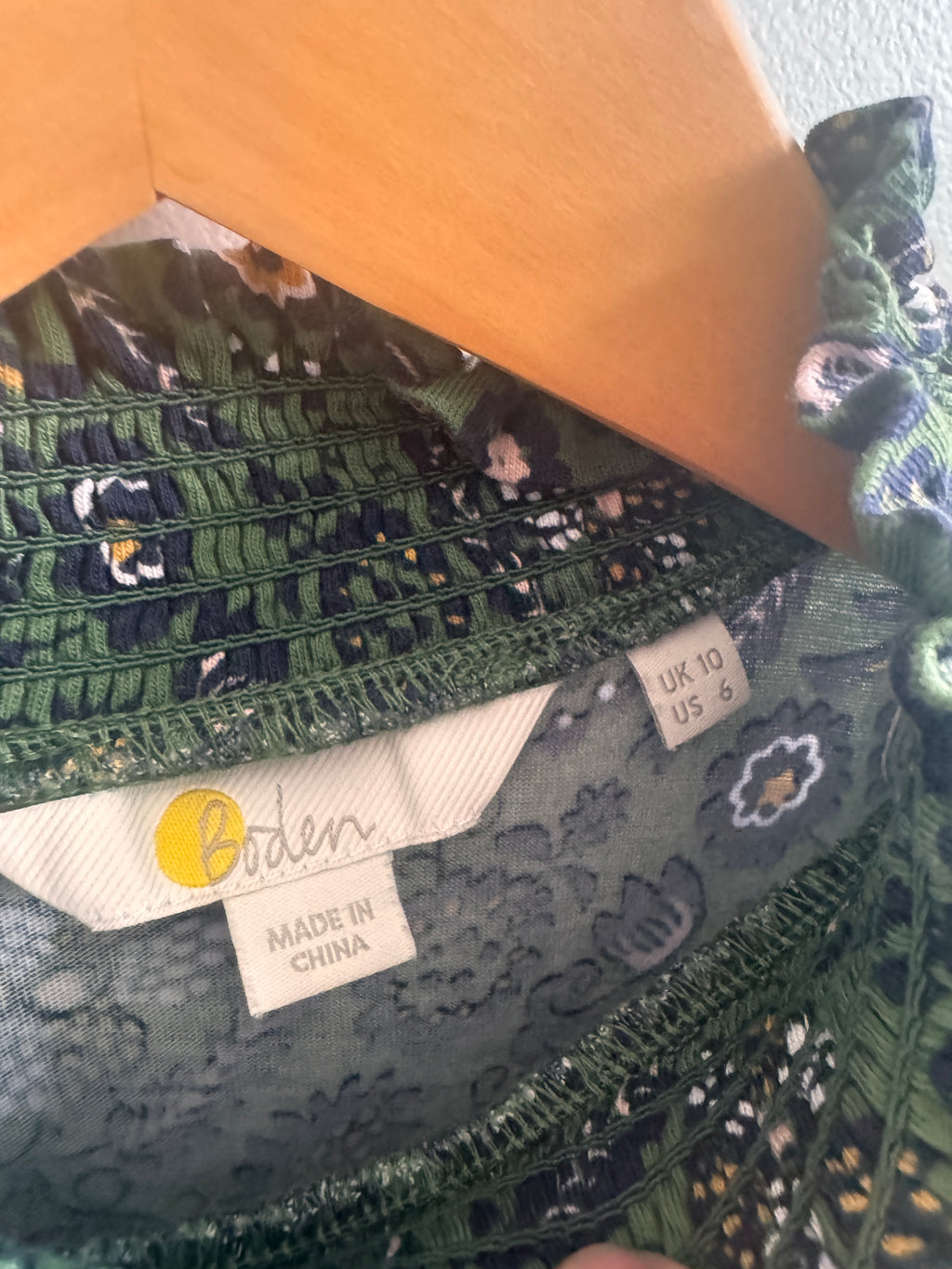Close-up of a fabric with floral patterns and visible 'Made in China' label.