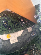 Close-up of a fabric with floral patterns and visible 'Made in China' label.