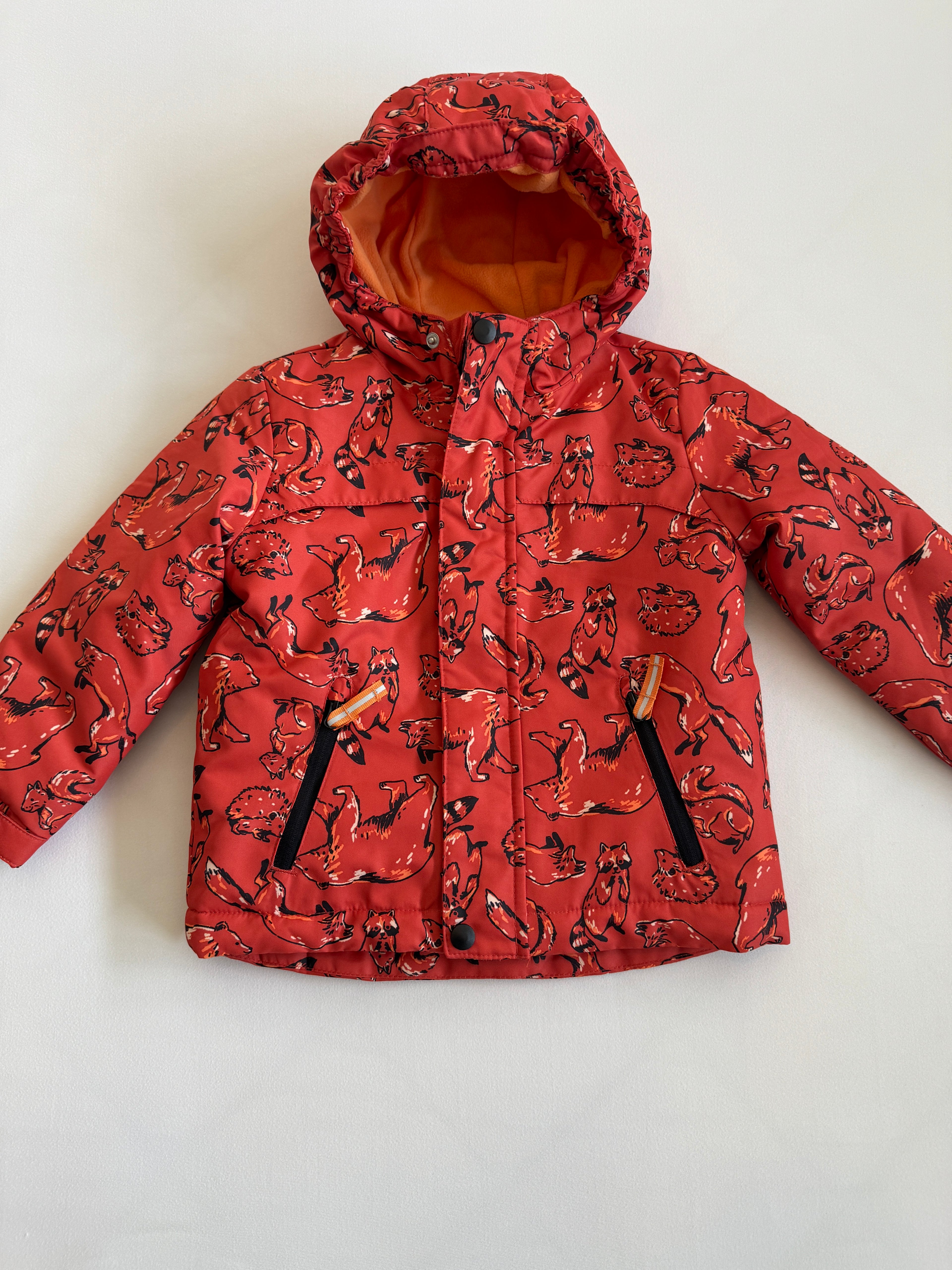 Red patterned jacket on a white background