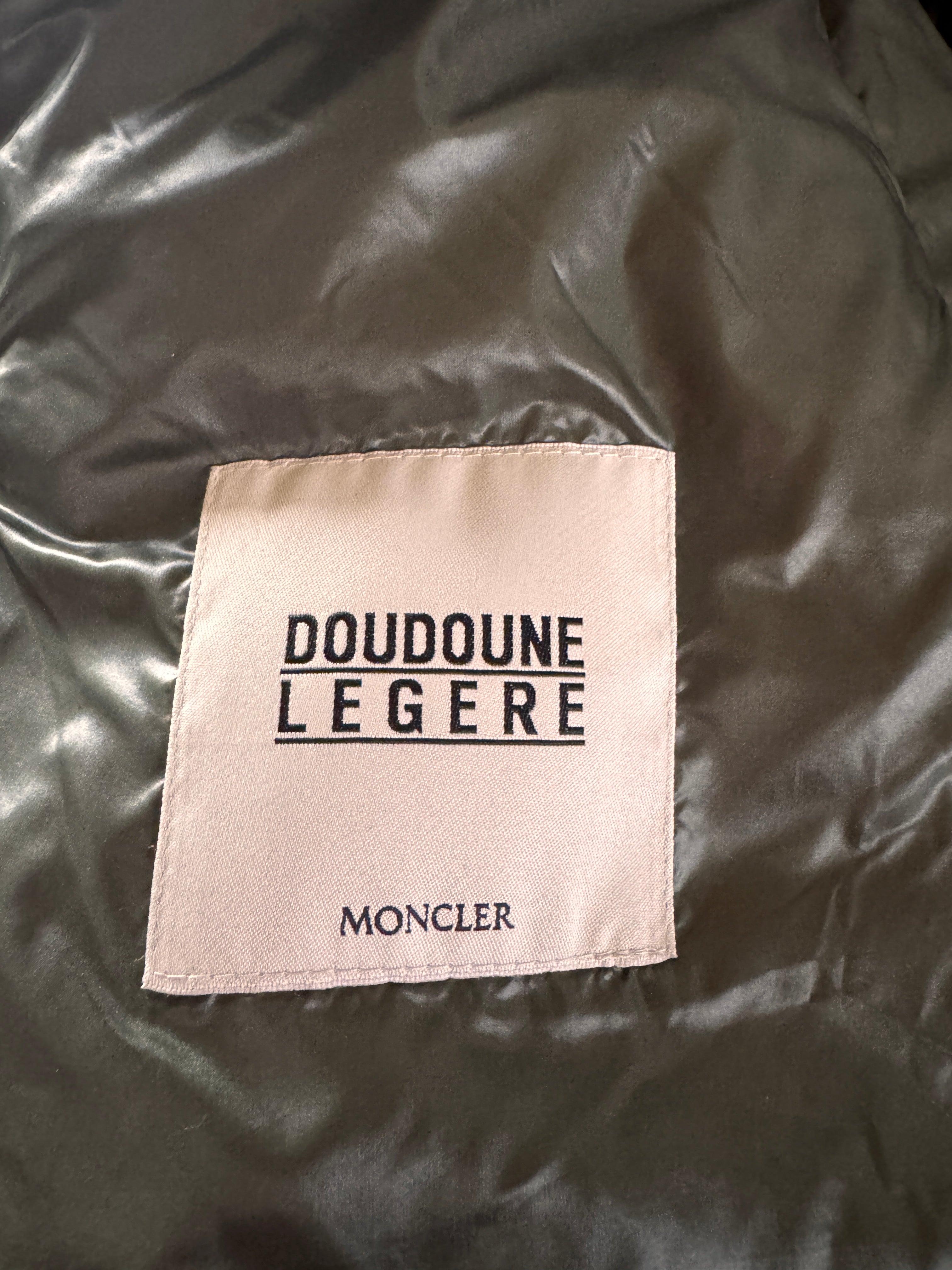 Moncler label on a dark fabric background
