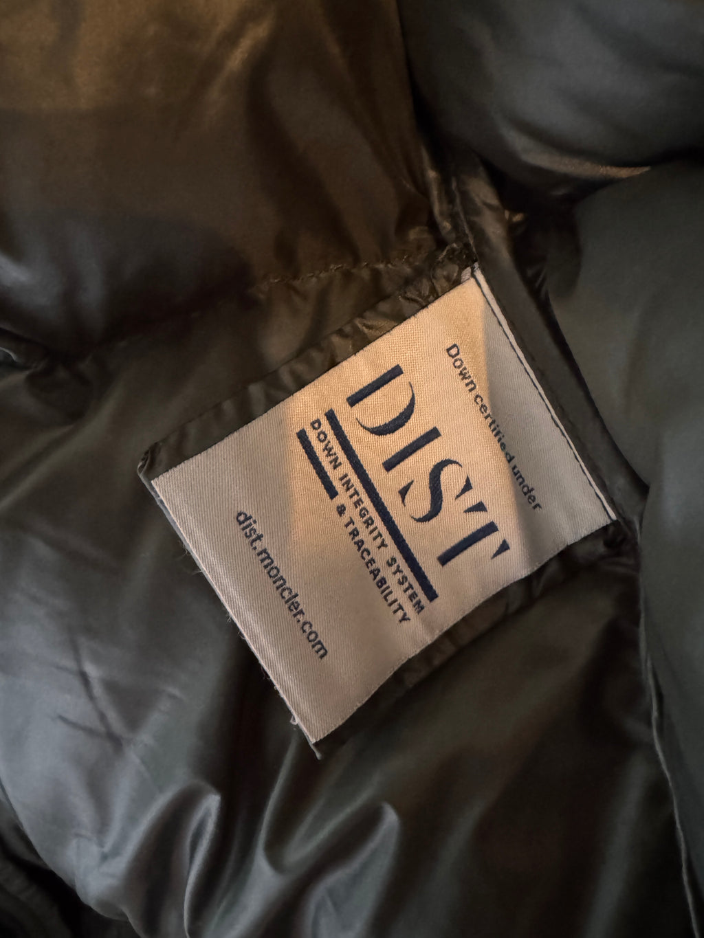 Label on a dark fabric surface with 'DIST' branding.