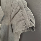 Gray jacket with a zipper on a gray background