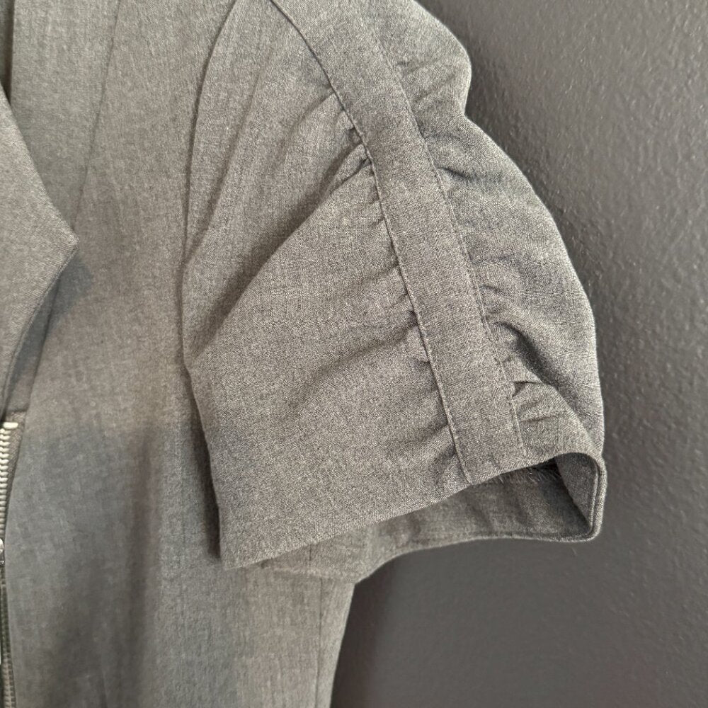 Gray jacket with a zipper on a gray background