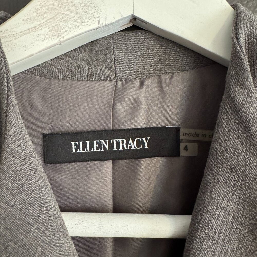 Gray suit dress with 'Ellen Tracy' label on a hanger