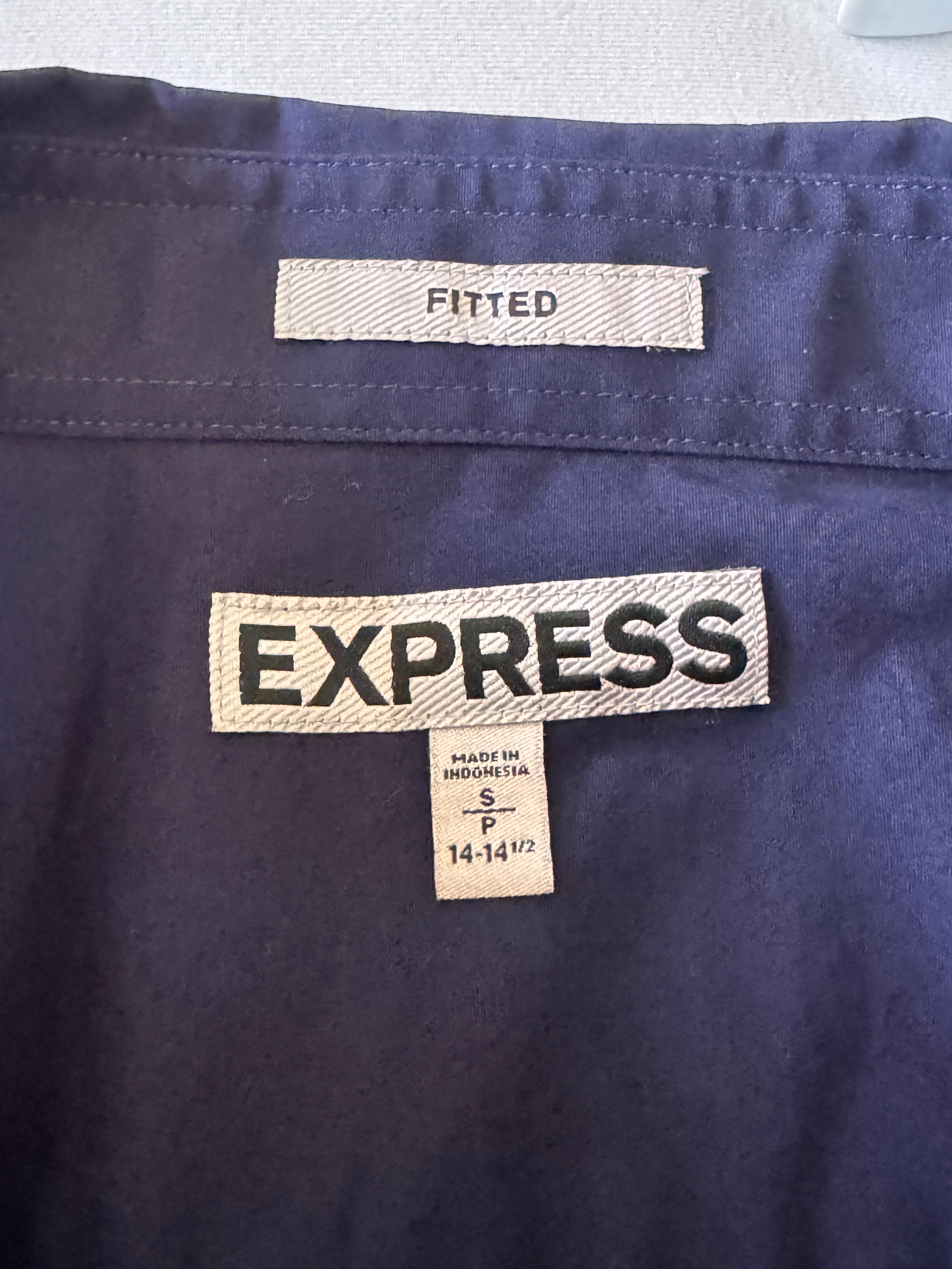 Close-up of Express clothing label on a navy fabric background