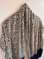 Folded floral-patterned fabric on a light background
