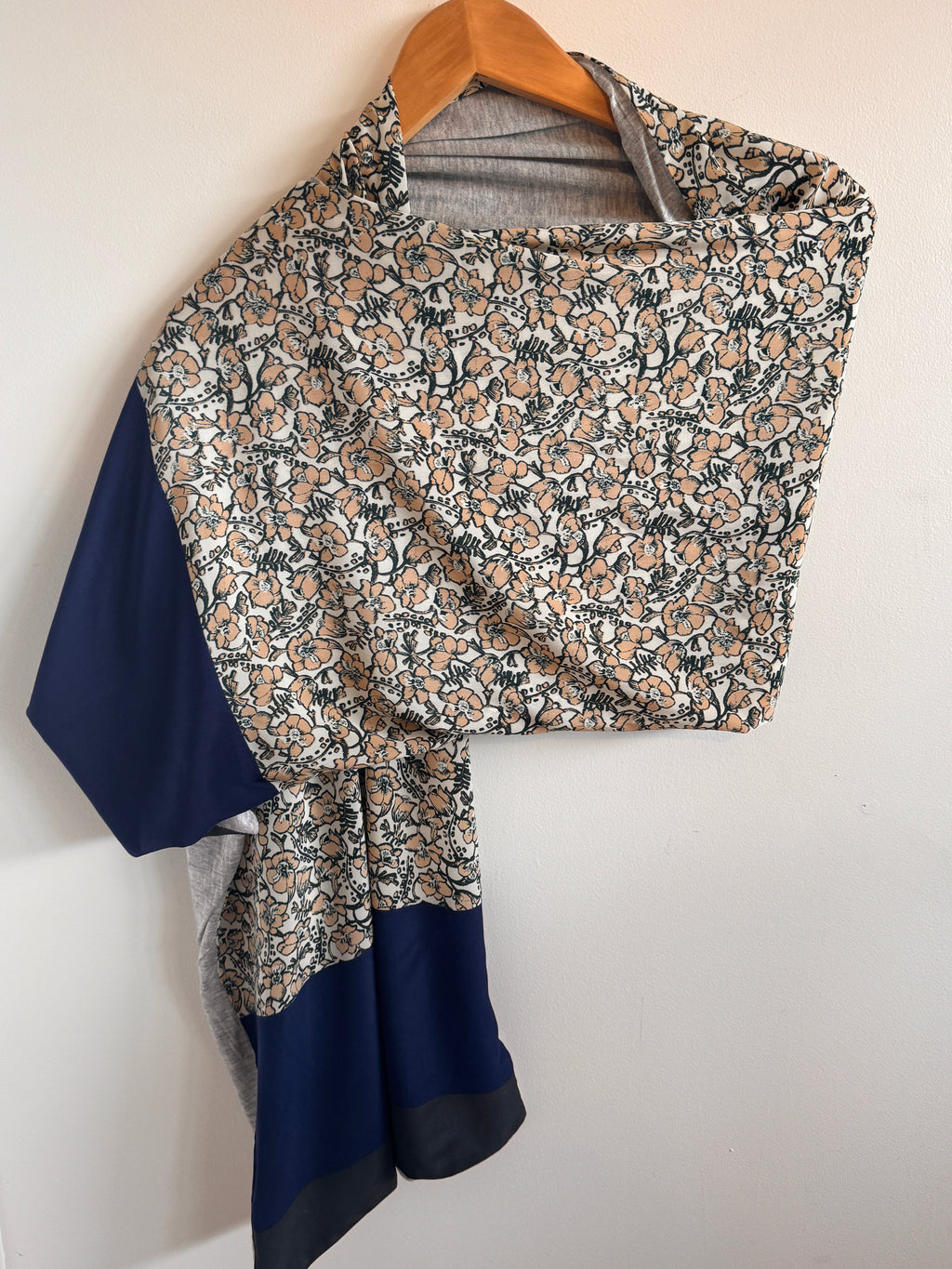 Floral-patterned bag with a blue interior on a white background