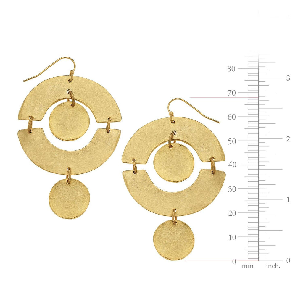 Gold earrings with a circular design on a white background with measurement scale.
