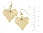 Gold heart-shaped earrings with a measurement scale on a white background