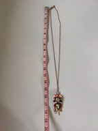 Floral headband with measuring tape for scale on a white background
