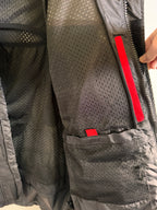 Jacket lining and pockets showing red on black mesh