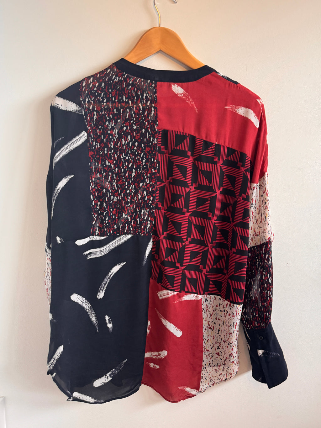 Stack of patterned fabric pieces on a white background