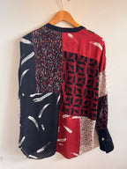 Stack of patterned fabric pieces on a white background