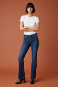 Bootcut jeans lifestyle editorial colored background