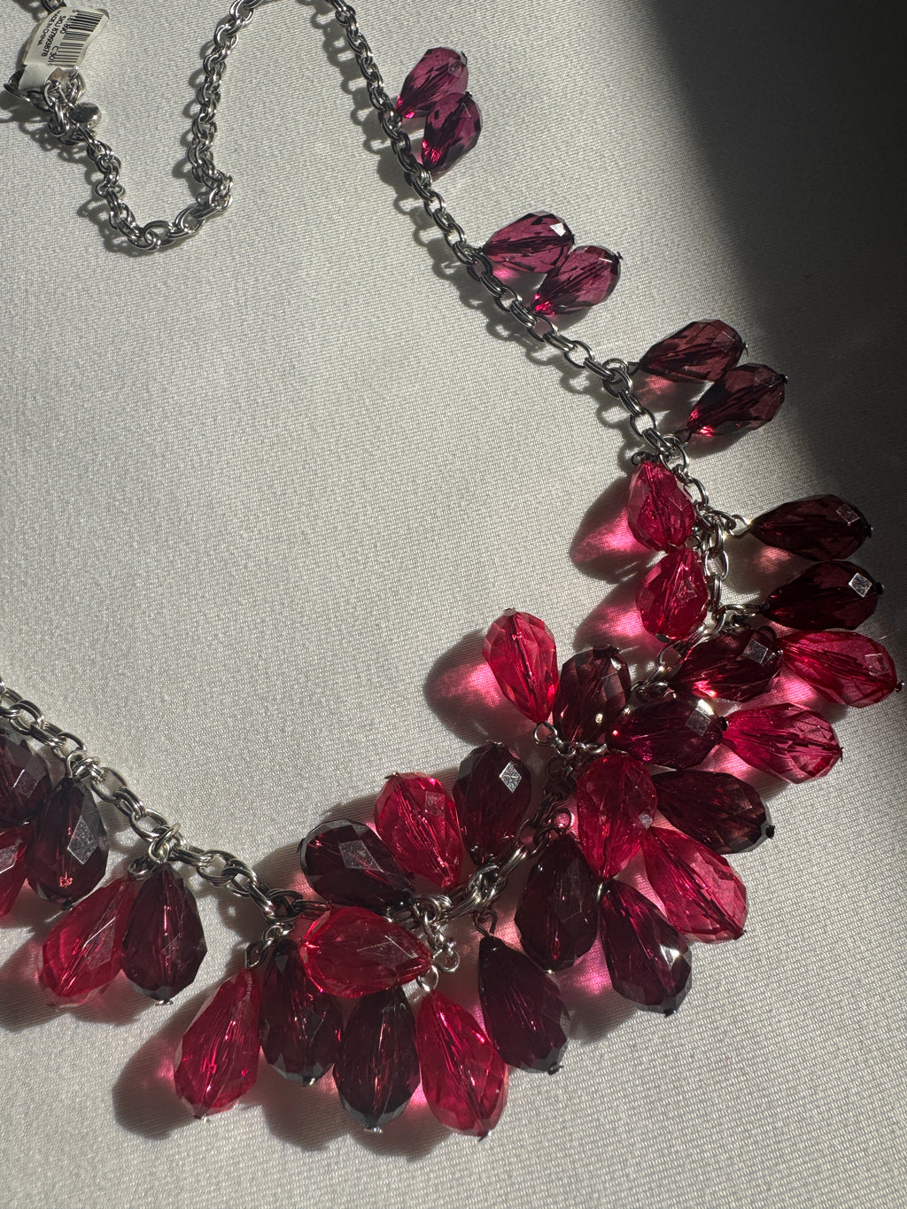 Necklace with red beads on a light background