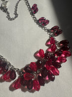 Necklace with red beads on a light background