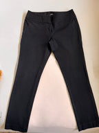 Black pants on a light beige background