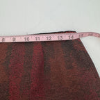 Brown fabric with a pink measuring tape on a white background