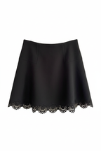 Black laser-cut skirt on white background