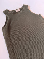 Green knitted tank top on a white background