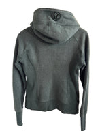 Lululemon sweatshirt with a logo on a beige surface
