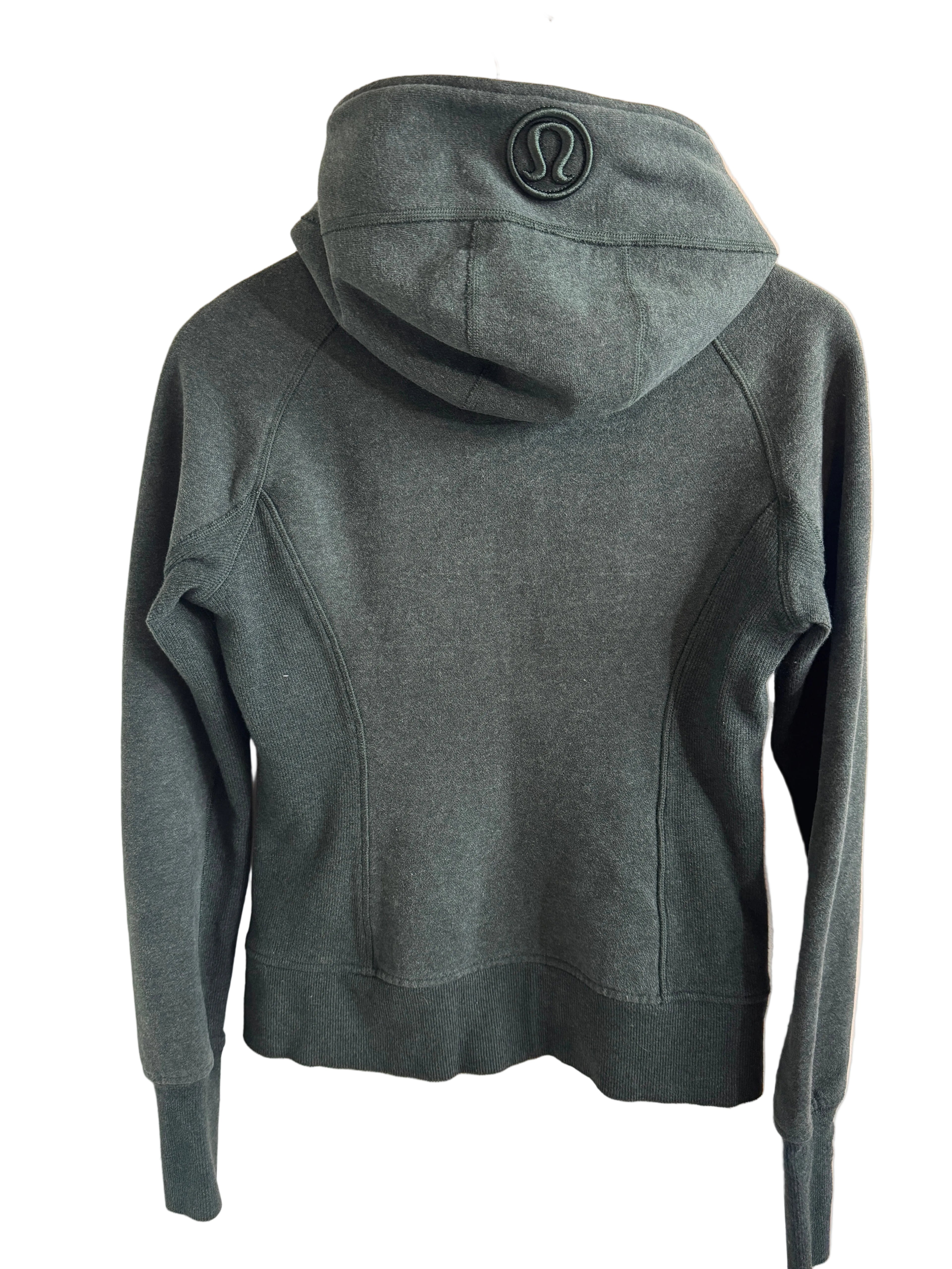 Lululemon sweatshirt with a logo on a beige surface