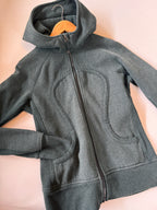 LLL jacket on a beige background