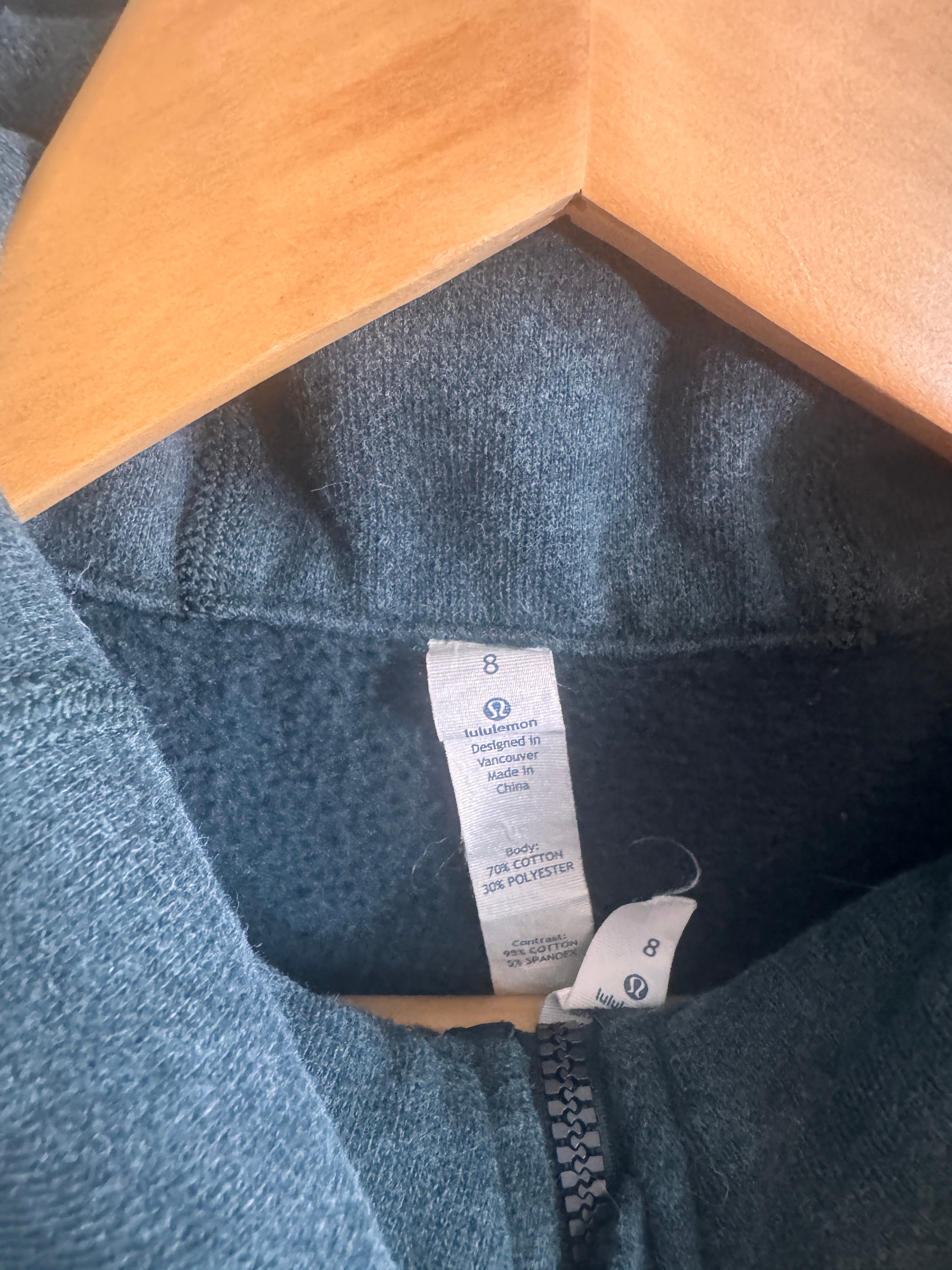 Green fleece jacket with a tag 