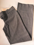 Gray checkered pants on a beige surface