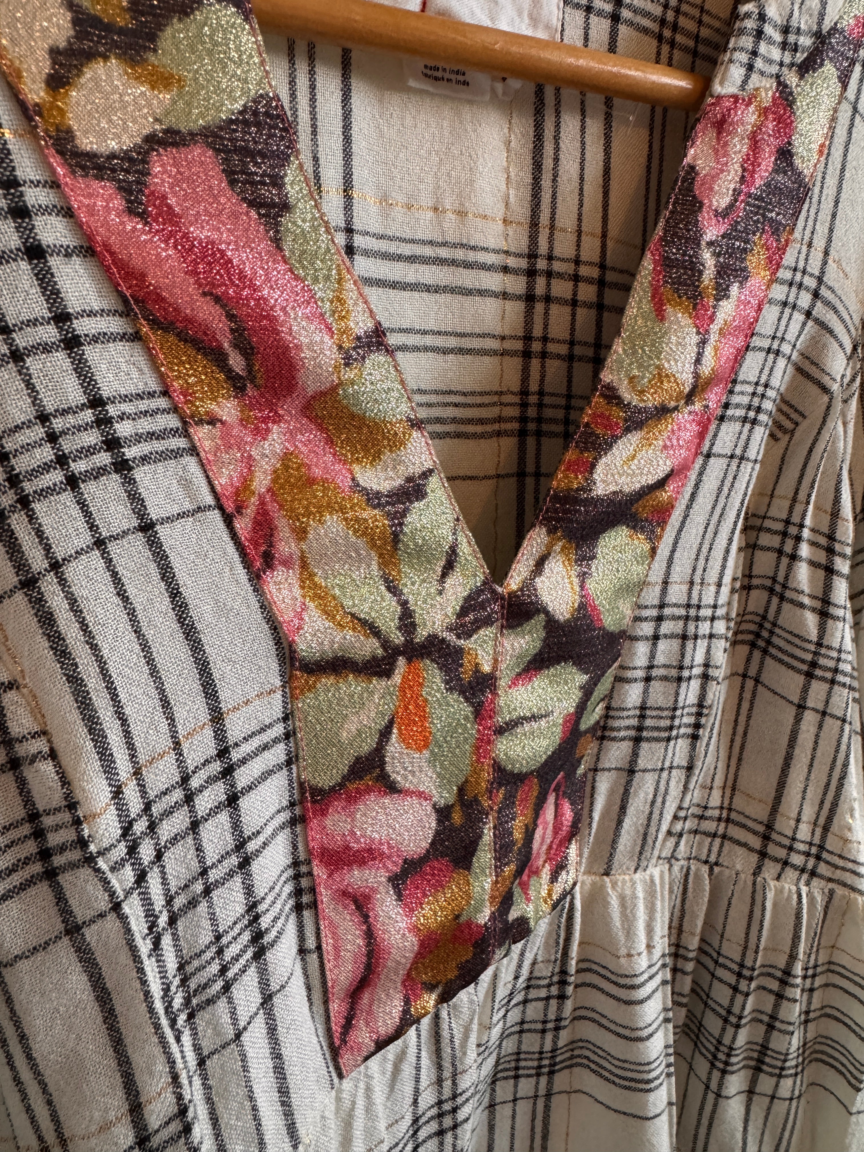 Close-up of floral fabric strip on checkered fabric background