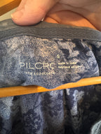 Close-up of a textured fabric with 'PILCRO' branding.