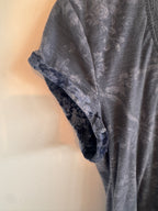Blue rolled up sleeve on t-shirt