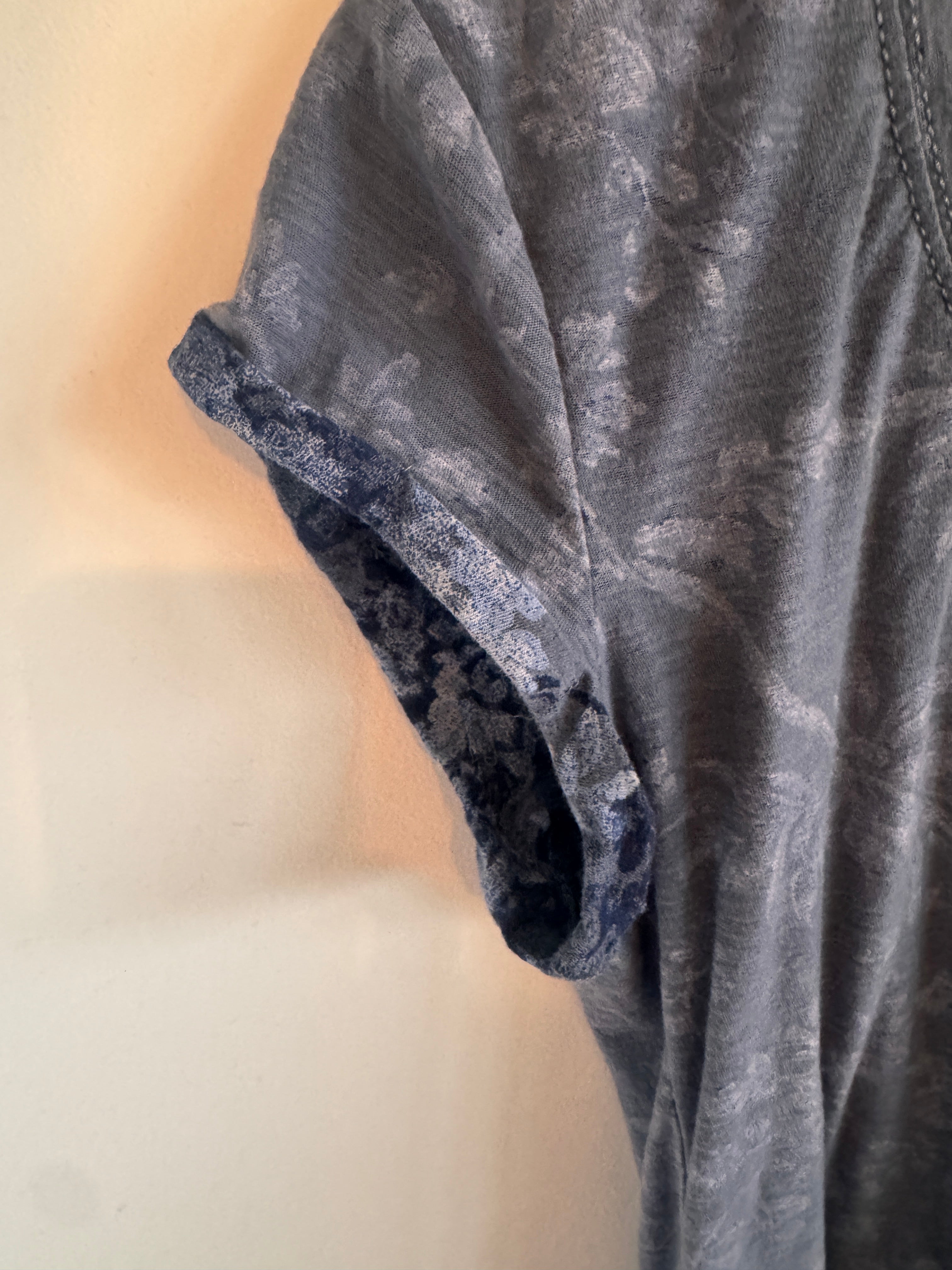 Blue rolled up sleeve on t-shirt