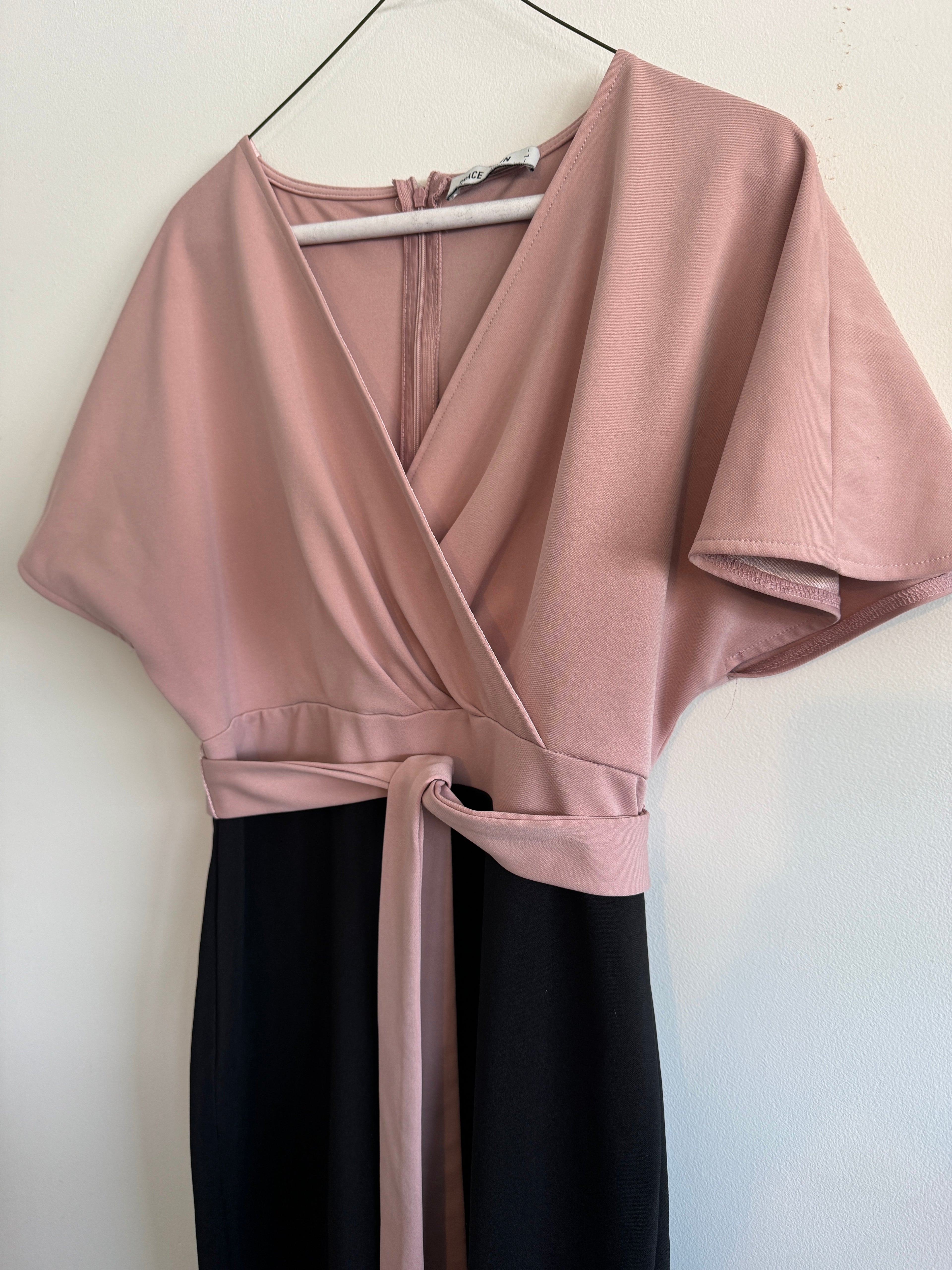 Dress hanging on a white surface