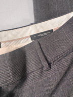 Close-up of a gray textured fabric with a brand label.