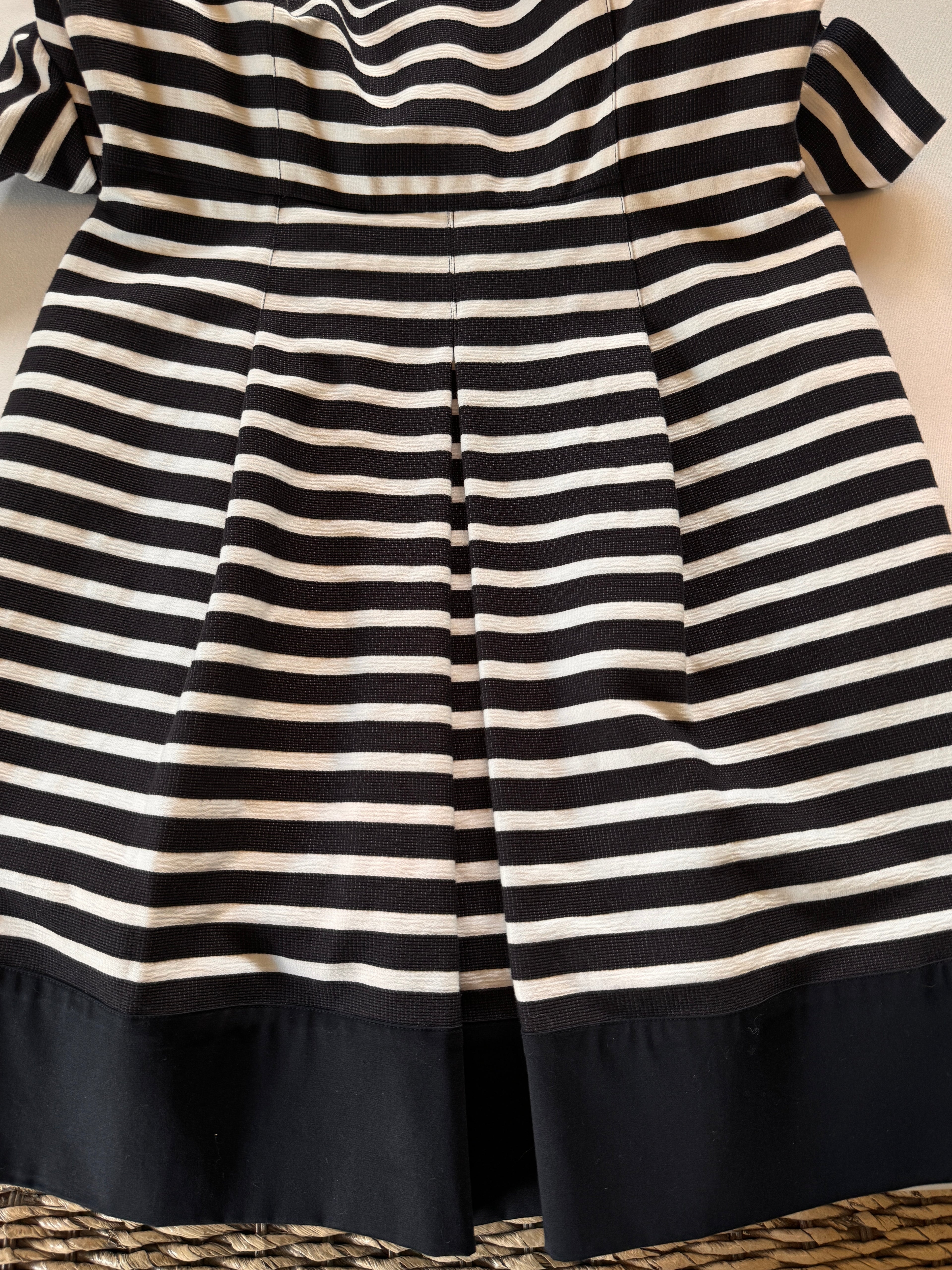 Dress skirt showing pleat and stripes 