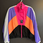 Colorful jacket with a brand label on a dark background