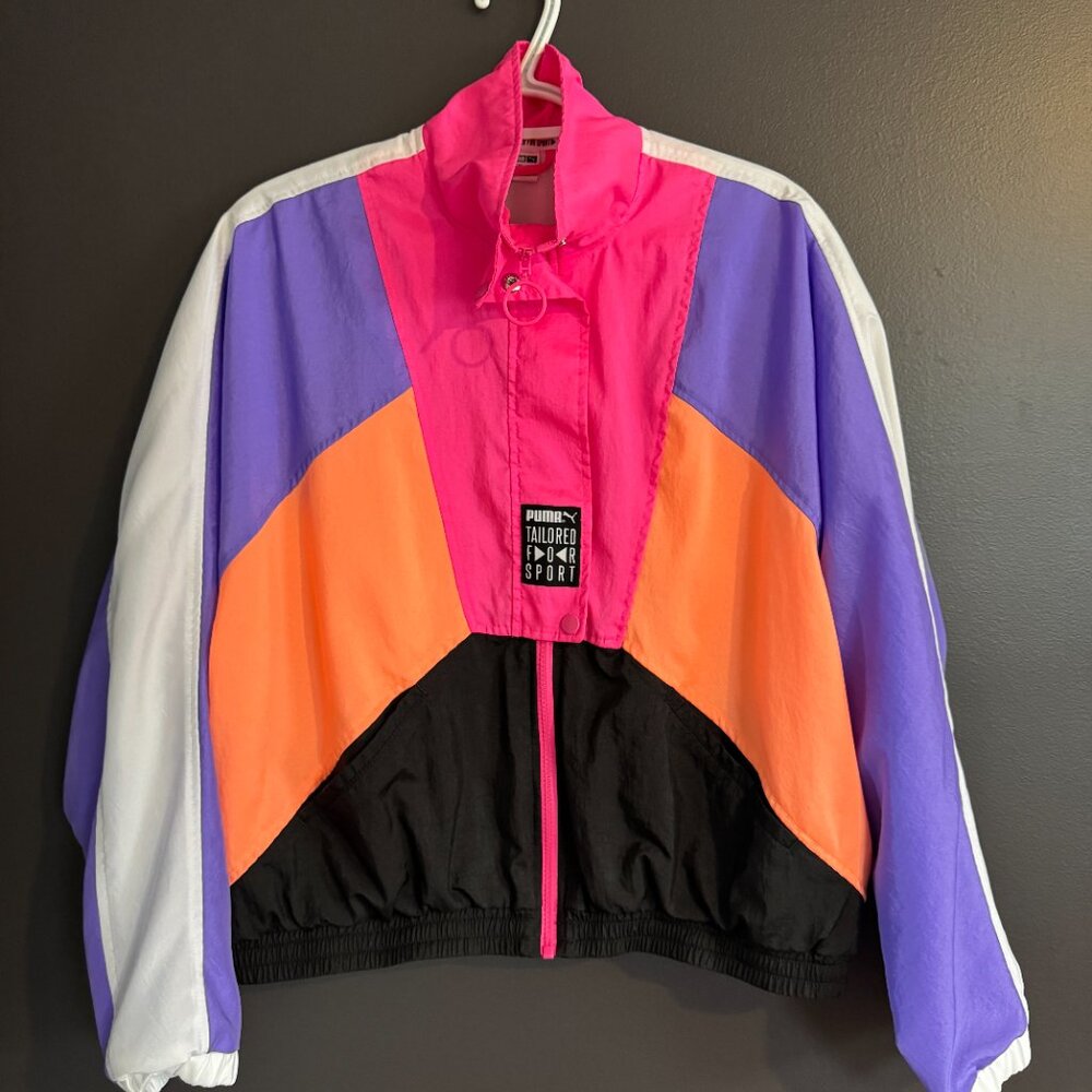 Colorful jacket with a brand label on a dark background