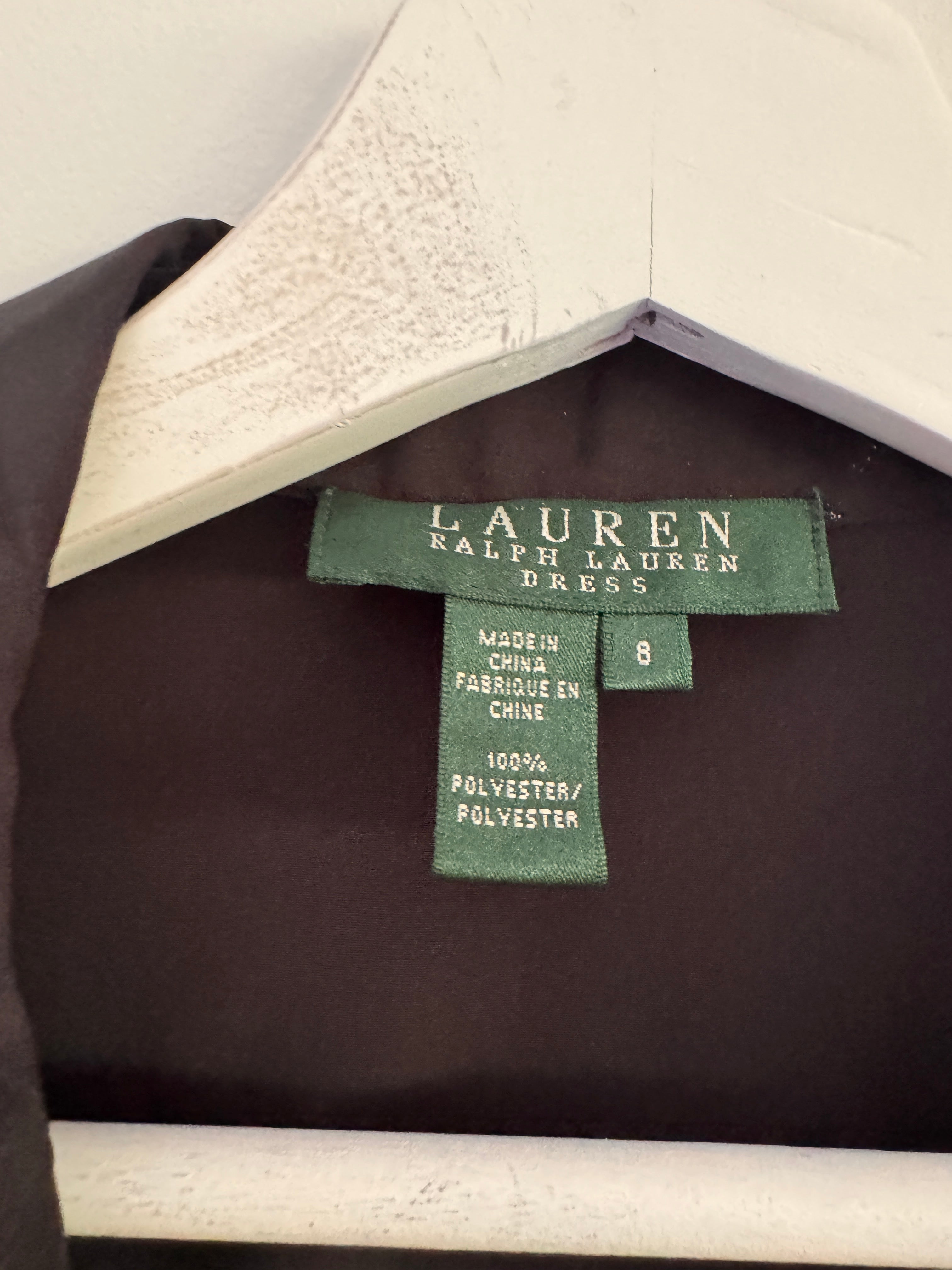 Ralph Lauren size 8 size tag attached, next to a white textured garment hanger.