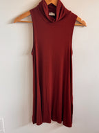 Rust Top on a hanger against a white wall
