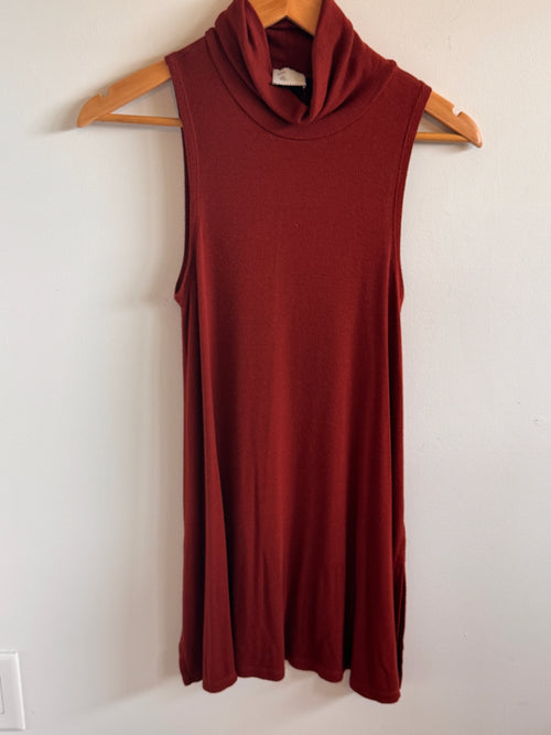 Rust Top on a hanger against a white wall