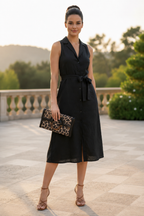 Woman holding animal print clutch
